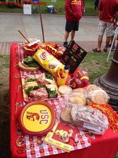 a red table topped with lots of food