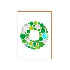 the letter c is made up of circles and dots in shades of green, blue, white