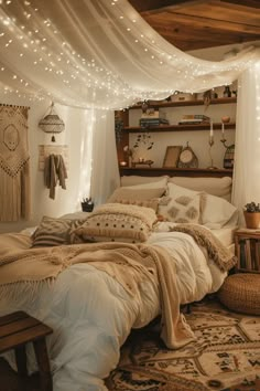 an unmade bed in a bedroom with string lights on the ceiling and curtains over it