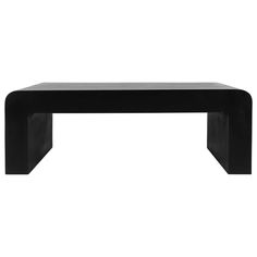 a black coffee table sitting on top of a white floor