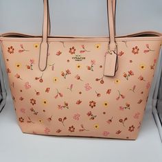 Brand: Coach Style: Mystical Floral Print City Tote / C8743 Condition: New With Tag Exterior Color: Faded Blush Multi Interior Features: Inside Zip Pocket Closure: Magnetic Snap Hardware Color: Gold Straps: Two Shoulder Straps Approx. Measurements: 13" L X 11.5" H X 6.25" W Includes: Coach Hangtag No Lowball Offers Or Trades Please. I Do Not Discuss Prices On Listings. Thank You For Looking! Coach Floral Print Bags For Everyday Use, Spring Coach Satchel Bag, Coach Spring Satchel Bag, Coach Everyday Bags For Spring, Coach Bags For Everyday Spring Use, Spring Coach Everyday Bags, Spring Coach Bags For Everyday Use, Coach Travel Bag For Spring, Coach Blush Bag For Everyday Use