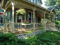 a house with flowers on the front porch