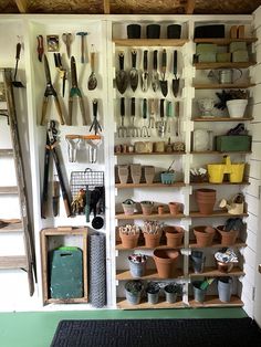 a room filled with lots of pots and gardening utensils