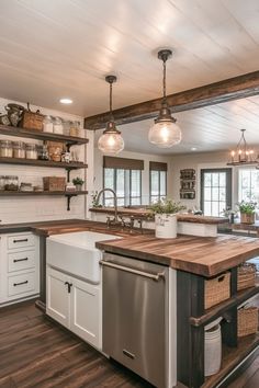 a large kitchen with an island in the middle and open shelving on the wall