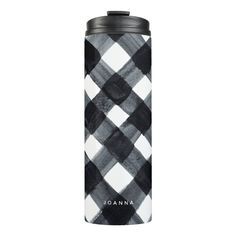 a black and white plaid flask with the name joanna printed on it's side