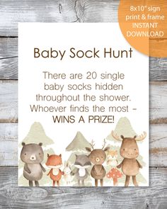 the baby sock hunt is on display in front of a wooden background with an orange circle