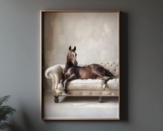 a horse laying on top of a couch next to a potted plant in a room