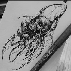 a pencil drawing of a squid with skulls on it's back and an ink pen next to it