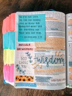 an open bible with colorful sticky notes on it