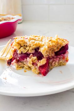 a piece of pie on a plate with a fork and bowl in the back ground