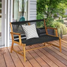 a wooden bench sitting on top of a wooden deck