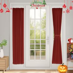 a room with red curtains and christmas decorations on the window sill next to a white door