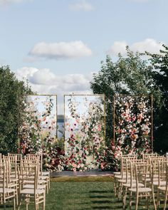 an outdoor ceremony setup with chairs and flowers