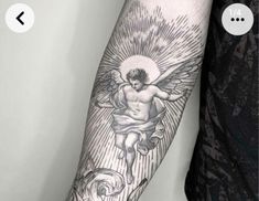 a man with a tattoo on his arm that has an angel and rose in it