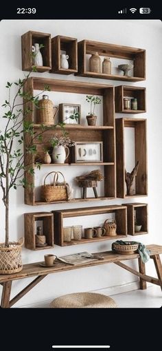 a wooden shelf filled with lots of shelves and baskets on top of it's sides