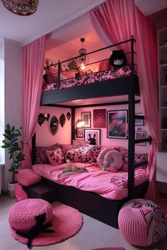 a bedroom with pink and black decor on the walls, bunk bed in the middle