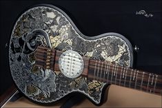 an intricately designed guitar is on display