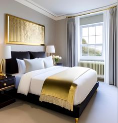 a bed with white and gold sheets in a bedroom