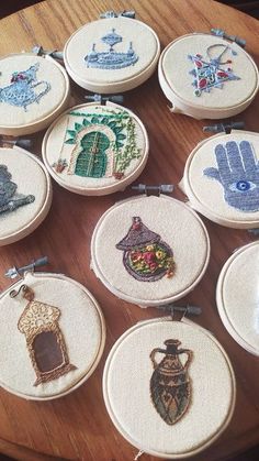 many different types of embroiderys are arranged on a table