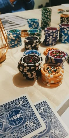 poker chips and playing cards on a table