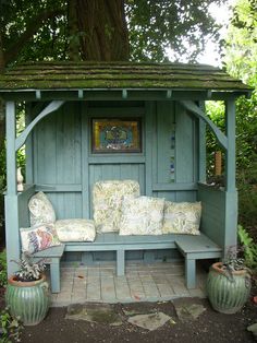 an image of a garden bench made out of old doors and shutters, with the caption're - escape com attach a little sitting cabana to the front of your shed '