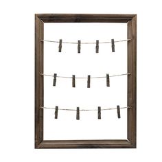 an old wooden frame with clothes pins hanging from it's sides on a white background