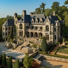 an aerial view of a large stone mansion