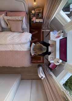 a woman standing next to a bed in a bedroom