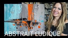 a woman standing in front of a painting with the words abstrati ludique