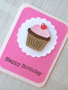 a pink card with a cupcake on it and the words happy birthday written below