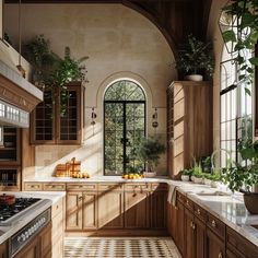 a kitchen filled with lots of wooden cabinets and counter top space next to a window