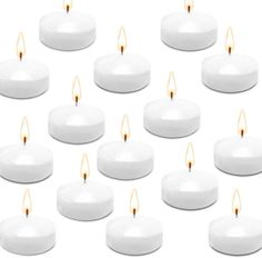 many white candles are lined up together