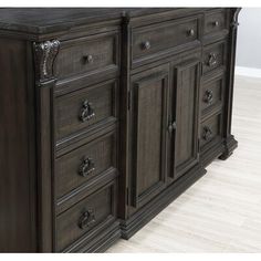 a large wooden dresser sitting on top of a hard wood floor