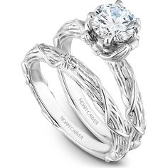 a white gold engagement ring set with an intricate vine design and a round diamond center stone