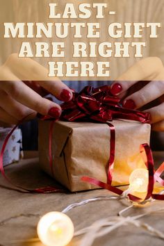 a person holding a wrapped present box with the words last minute gift are right here