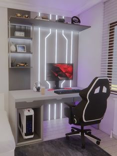 a desk with a computer on it in a room