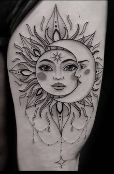 a sun and moon tattoo on the thigh