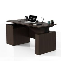 an office desk with a laptop on it