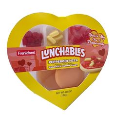 a heart shaped lunchable box filled with meat and veggies