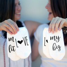 two women are holding towels that say i love my big