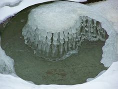 the ice is melting on the water in the pond