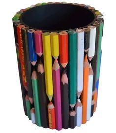 several colored pencils are arranged in the shape of a cup