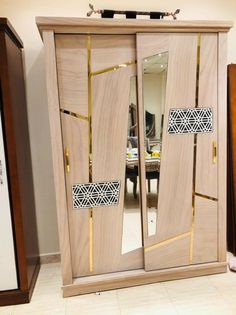 a large wooden cabinet with mirrored doors