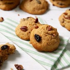 several cookies with pecans and raisins on a towel