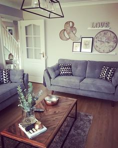 a living room with two couches and a coffee table