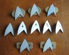 the paper airplanes have numbers on them and are ready to be made into magnets