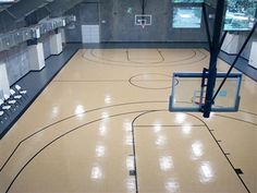 an indoor basketball court with chairs and tables