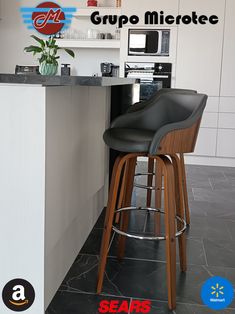 the bar stools are next to the counter in the kitchen with an advertisement on it