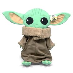 the child yoda plush toy is wearing a scarf