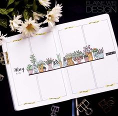 an open planner with plants on it